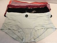 Stack of five new La Vie en Rose size M underwear showing assorted colours