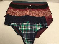 Stack of five underwear showing variety of colours and styles