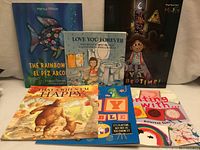 Front view of all six books displayed