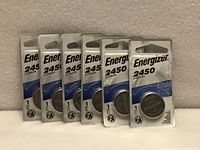 Six sealed Energizer 2450 lithium coin batteries in blister packs