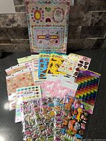 Overview of all sealed sticker packs displayed on countertop