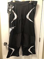 Full view of Mission roller hockey pants hanging