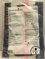 Front of sealed Pampered Chef package showing product sheet through plastic