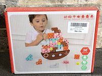 Front of sealed box showing toy contents and age rating