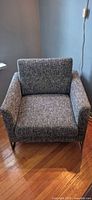 Front view of armchair showing upholstery and overall design