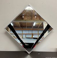 front view of mirror showing black glass accents