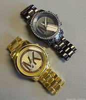 Top view of both watches showing overall style and condition