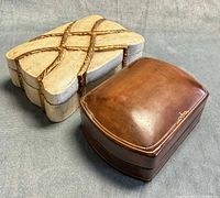 Both boxes closed, top view showing materials and finishes