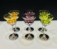 Six colored Farber Brothers chrome stem cocktail glasses frontal view