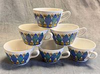 Six stacked Figgjo Flint Turi Design coffee cups front view