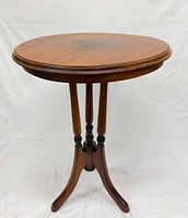 Full view of walnut plant stand / side table showing entire form