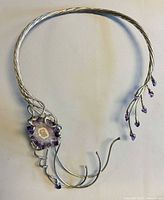 Full view of twisted wire collar showing asymmetrical amethyst slice focal and tendril design