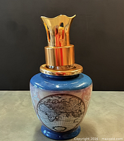 Full view of ceramic Lampe Berger with gold-tone crown