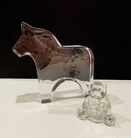 Front view of both glass figurines
