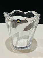 Full view of crystal vase front showing shape and label