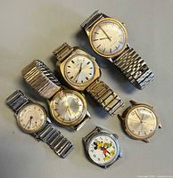 Group shot of six vintage wristwatches showing overall variety and condition
