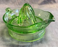 Oblique view showing crisscross pattern, cone, handle, spout