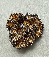 Front view of textured sterling silver brooch