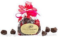 Bag of assorted artisan chocolates in clear cello bag with pink ribbon and CocoaBistro label