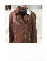 Front view of brown leather biker jacket showing asymmetrical zipper, notch collar and zip pockets