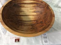 Overhead view of bowl interior on white drape with Stinson Studios business card and lot number card