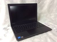 Front view of laptop open showing screen, keyboard and trackpad