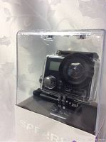 Front view of Safari 4 camera in waterproof housing inside clear packaging