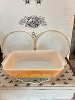 Front view of loaf pan and two bowls