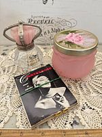 All three items grouped: perfume bottle, frosted jar, Chatelaine booklet