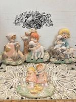 Front view showing all four chalkware plaques