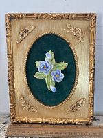 Front view of framed floral relief