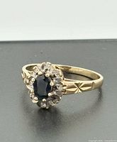 Front view of gold sapphire halo ring