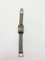 Full view of Bulova wristwatch laid flat showing bracelet links