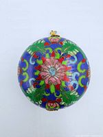 Front view of round cloisonné pendant
