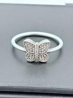 Top view of sterling butterfly ring showing pavé details