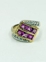 Front view showing pink sapphires and accent stones