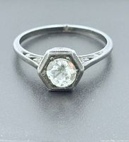 Front view showing hexagonal bezel and stone