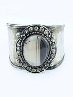 Front view of sterling cuff showing banded agate and ornate bezel