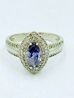 Front view of sterling silver tanzanite halo ring
