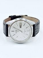 Front three-quarter view showing dial, case and strap