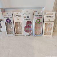 Group shot of all five boxed nail kits