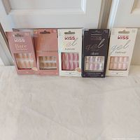 Group shot of all five sealed Kiss nail kits