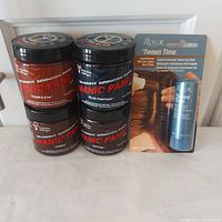 Group shot of four Manic Panic jars and Roux touch-up stick in packaging