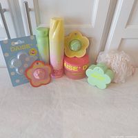 Group shot of all eight Daise items and mesh puff