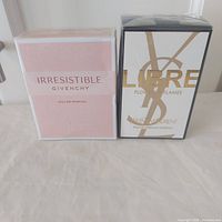 Front view of both sealed perfume boxes