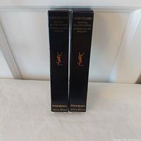 Front view of two boxed YSL Lash Clash mascaras