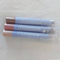 Three sealed Florence by Mills Eye Candy eyeshadow sticks stacked