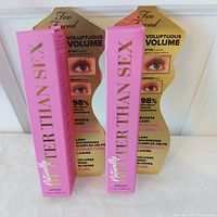 Front view of two boxed Too Faced Better Than Sex mascaras with gold inserts