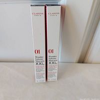 Front view of two Clarins Wonder Volume Mascara XXL boxes