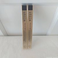 Front view of two boxed eyeliners standing upright